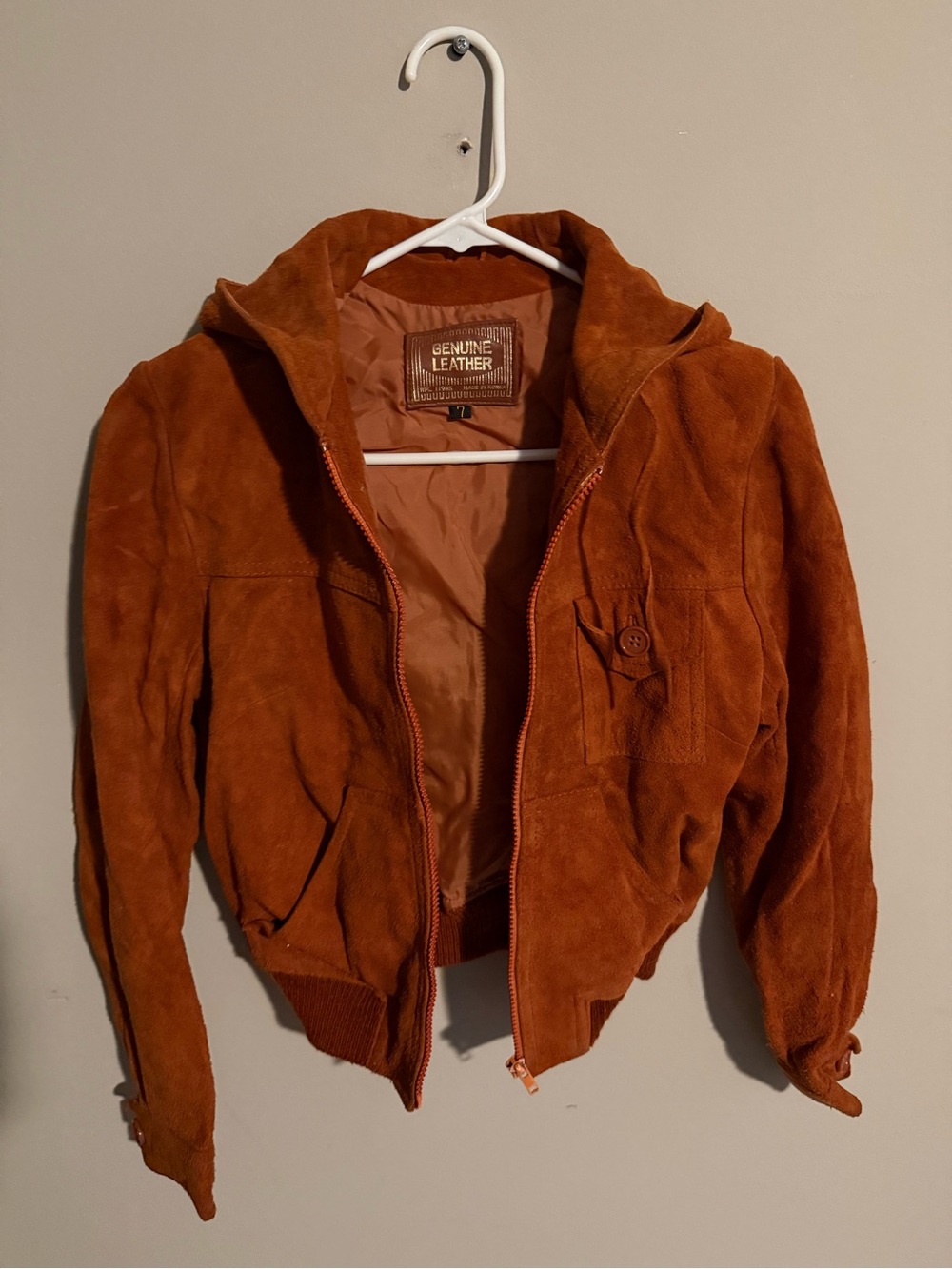 Vintage burnt orange genuine leather jacket with hood, drawstrings, and pockets